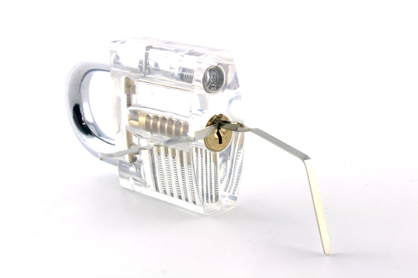 Soho lock rakes inserted into a transparent practice lock on a white background