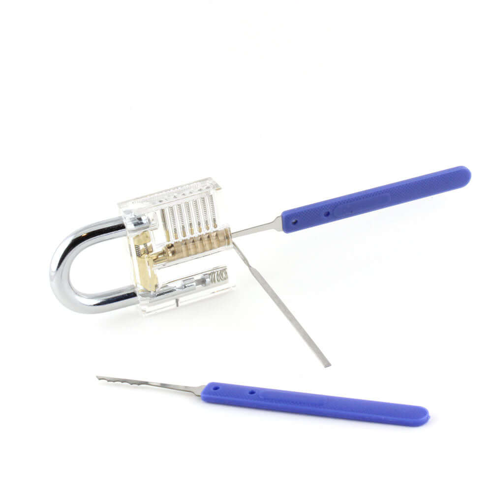 Lock pick tip into a practice padlock. Tension tool also. Another Lock pick on the ground