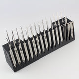 Set of lockpicks in a black holder on a white background