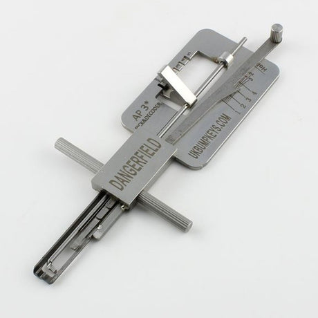 Metal APECS Lock Picking tool with engraved text on a white background
