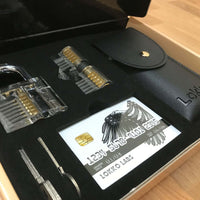 Close up of Lokko lock pick set contents. 2 locks, 3 keys, wallet with lock picks and spy kit with lockpicks and tools